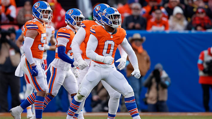 Jan 5, 2025; Denver, Colorado, USA; Denver Broncos linebacker Jonathon Cooper (0) reacts ahead of teammates after a sack in the second quarter against the Kansas City Chiefs at Empower Field at Mile High. Jan 5, 2025; Denver, Colorado, USA; Denver Broncos linebacker Jonathon Cooper (0) reacts ahead of teammates after a sack in the second quarter against the Kansas City Chiefs at Empower Field at Mile High.