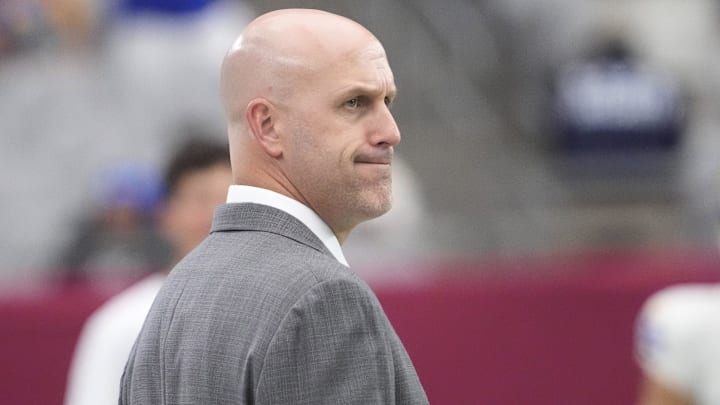 Arizona Cardinals general manager Monti Ossenfort watches his team warm up before playing against the Los Angeles Rams at State Farm Stadium on Sept. 15, 2024.