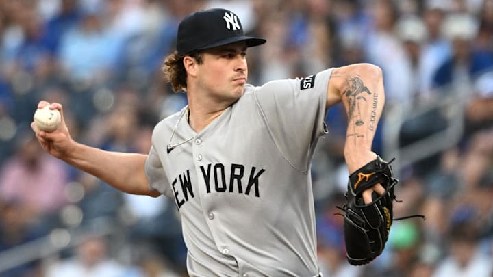 Jul 22, 2025; Toronto, Ontario, CAN;   New York Yankees starting pitcher Cam Schlittler (31) delives a pitch against the Toronto Blue Jays in the first inning at Rogers Centre. Mandatory Credit: Dan Hamilton-Imagn Images