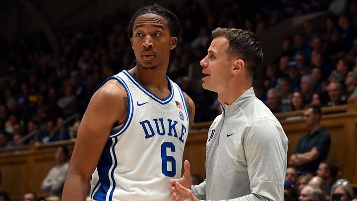 Nov 21, 2025; Durham, North Carolina, USA; Duke Blue Devils head coach Jon Scheyer (right) talks to forward Maliq Brown (6) during the second half against the Niagara Purple Eagles at Cameron Indoor Stadium. Mandatory Credit: Rob Kinnan-Imagn Images