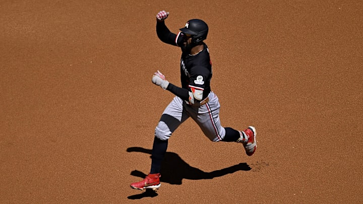 Sep 25, 2025; Arlington, Texas, USA; Minnesota Twins center fielder Byron Buxton (25) rounds second base after he hits a leadoff home run against the Texas Rangers during the first inning at Globe Life Field. Mandatory Credit: Jerome Miron-Imagn Images