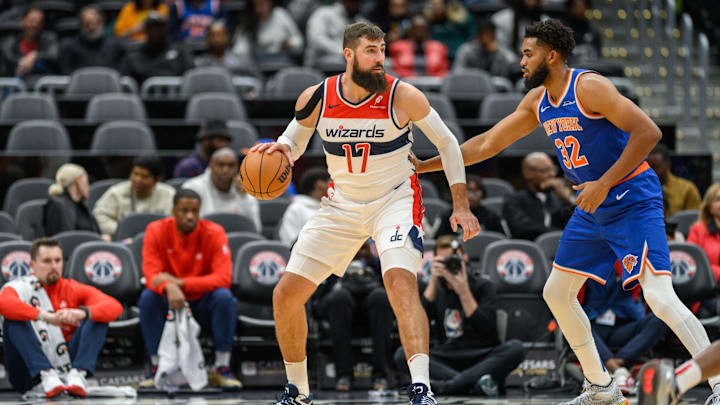Oct 18, 2024; Washington, District of Columbia, USA; Washington Wizards center Jonas Valanciunas (17) dribbles the ball while being defended by New York Knicks center Karl-Anthony Towns (32) during the first quarter at Capital One Arena. Mandatory Credit: Reggie Hildred-Imagn Images