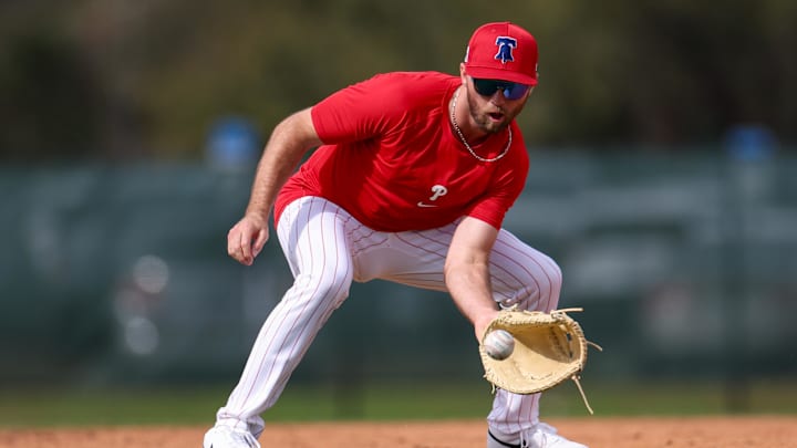 Feb 19, 2025; Clearwater, FL, USA; Philadelphia Phillies first base Kody Clemens (2) takes fielding practice during spring training workouts at BayCare Ballpark. Mandatory Credit: Nathan Ray Seebeck-Imagn Images