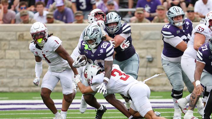 Sep 12, 2026; Manhattan, Kansas, USA; Kansas State Wildcats running back Rodney Fields Jr. (20) is tackled by Washington State Cougars defensive back Jaylen Thomas (3) during the second quarter at Bill Snyder Family Football Stadium. Mandatory Credit: Scott Sewell-Imagn Images Sep 12, 2026; Manhattan, Kansas, USA; Kansas State Wildcats running back Rodney Fields Jr. (20) is tackled by Washington State Cougars defensive back Jaylen Thomas (3) during the second quarter at Bill Snyder Family Football Stadium. Mandatory Credit: Scott Sewell-Imagn Images