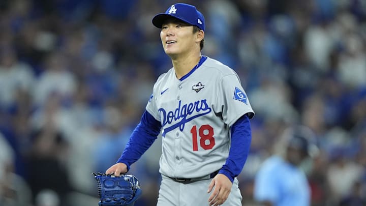 Los Angeles Dodgers pitcher Yoshinobu Yamamoto (18) reacts in the sixth inning against the Toronto Blue Jays during game six of the 2025 MLB World Series at Rogers Centre.