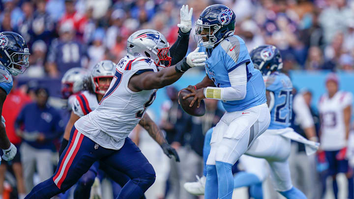 New England Patriots defensive end Milton Williams (97) sacks Tennessee Titans quarterback Cam Ward (1) during the third quarter at Nissan Stadium in Nashville, Tenn., Sunday, Oct. 19, 2025. New England Patriots defensive end Milton Williams (97) sacks Tennessee Titans quarterback Cam Ward (1) during the third quarter at Nissan Stadium in Nashville, Tenn., Sunday, Oct. 19, 2025.