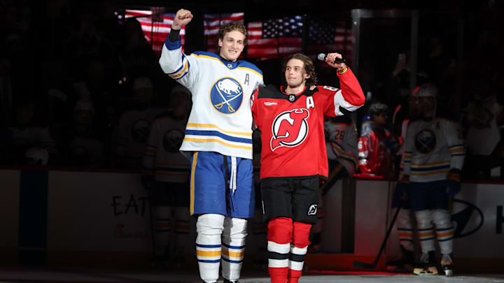 Feb 25, 2026; Newark, New Jersey, USA; New Jersey Devils center Jack Hughes (86) and Buffalo Sabres center Tage Thompson (72) take a lap on the ice prior to the start of their game at Prudential Center. The two were teammates for the gold medal winning Team USA men’s ice hockey team at the 2026 Milan Olympics. 