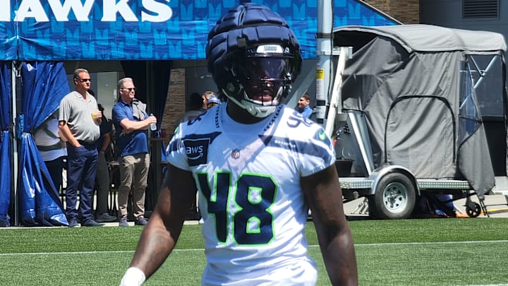 Seahawks linebacker Tyrice Knight walks back to the huddle after a drill during the team's mandatory minicamp at the VMAC.