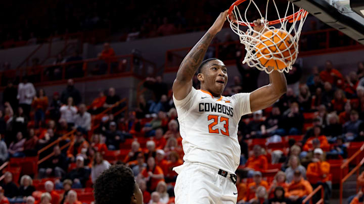 Jan 6, 2024; Stillwater, Okla, USA; Oklahoma State Cowboys center Brandon Garrison (23) slam dunks