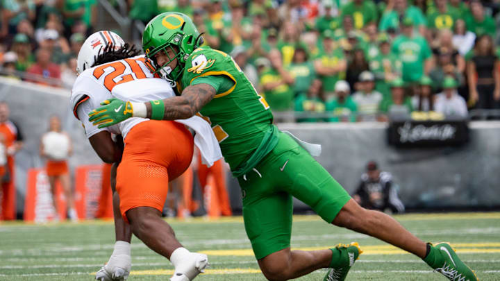 Laying the Wood: Safety Peyton Woodyard stops Oklahoma State running back Rodney Fields.