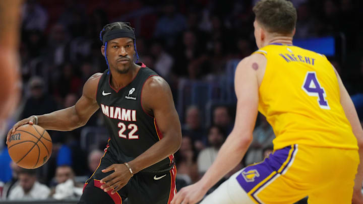 Dec 4, 2024; Miami, Florida, USA;  Miami Heat forward Jimmy Butler (22) dribbles against the Los Angeles Lakers in the first half at Kaseya Center. Mandatory Credit: Jim Rassol-Imagn Images