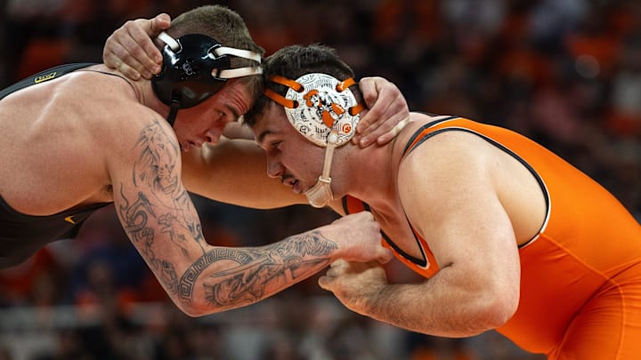 Feb 25, 2024; Stillwater, Okla, USA; Iowa heavyweight Ben Kueter grapples with Oklahoma State's Konner Doucet during a match in Gallagher Iba Arena. Mandatory Credit: Mitch Alcala-The Oklahoman