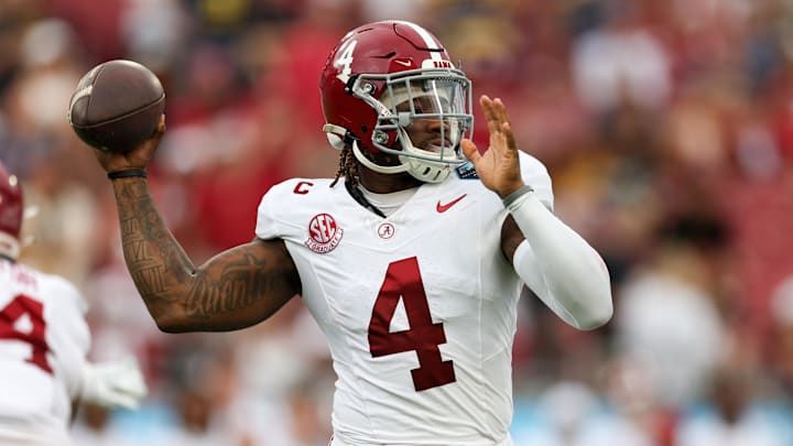 Dec 31, 2024; Tampa, FL, USA; Alabama Crimson Tide quarterback Jalen Milroe (4) drops back to pass against the Michigan Wolverines in the first quarter  during the ReliaQuest Bowl at Raymond James Stadium.