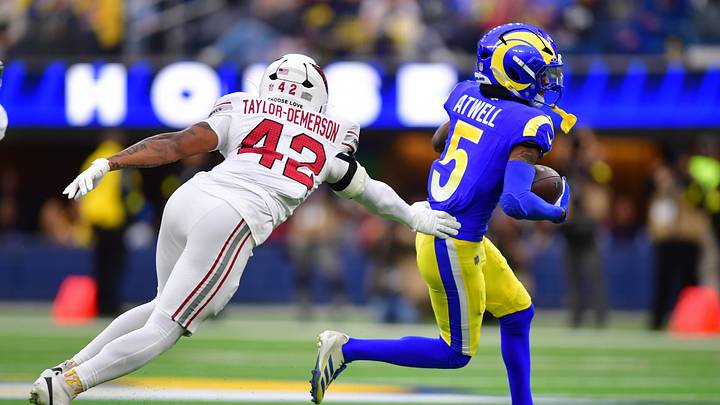 Jan 4, 2026; Inglewood, California, USA; Los Angeles Rams wide receiver Tutu Atwell (5) runs after the catch as Arizona Cardinals safety Dadrion Taylor-Demerson (42) defends during the first half at SoFi Stadium. Mandatory Credit: Gary A. Vasquez-Imagn Images Jan 4, 2026; Inglewood, California, USA; Los Angeles Rams wide receiver Tutu Atwell (5) runs after the catch as Arizona Cardinals safety Dadrion Taylor-Demerson (42) defends during the first half at SoFi Stadium. Mandatory Credit: Gary A. Vasquez-Imagn Images