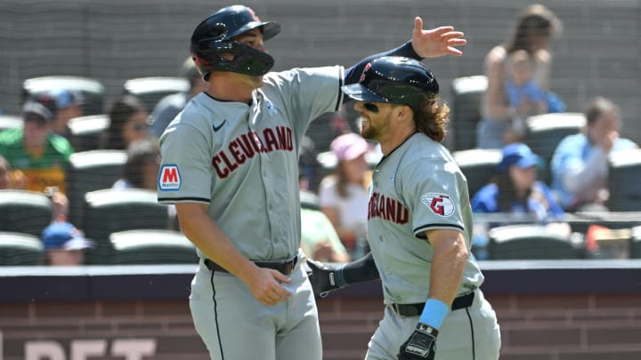 Jun 16, 2024; Toronto, Ontario, CAN;  Cleveland Guardians third baseman Daniel Schneemann (10) is greeted at home plate by right fielder Will Brennan (17) after hitting a two run home run against the Toronto Blue Jays in the sixth inning at Rogers Centre. Mandatory Credit: Dan Hamilton-USA TODAY Sports