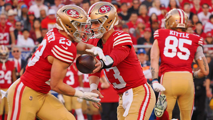 Jan 28, 2024; Santa Clara, California, USA; San Francisco 49ers quarterback Brock Purdy (13) hands the ball off to running back Christian McCaffrey (23) during the first half of the NFC Championship football game at Levi's Stadium. Mandatory Credit: Kelley L Cox-Imagn Images Jan 28, 2024; Santa Clara, California, USA; San Francisco 49ers quarterback Brock Purdy (13) hands the ball off to running back Christian McCaffrey (23) during the first half of the NFC Championship football game at Levi's Stadium. Mandatory Credit: Kelley L Cox-Imagn Images