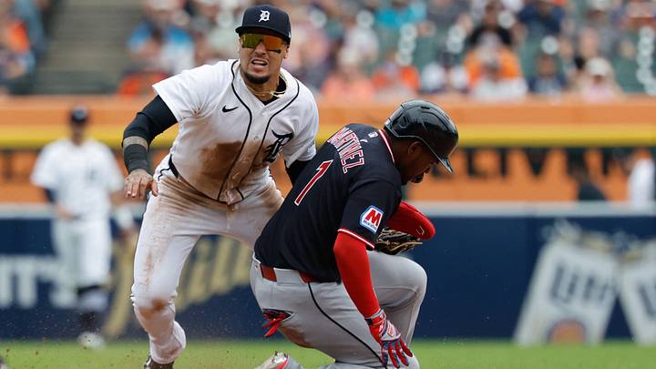 Aug 13, 2026: Detroit Tigers shortstop Javier Baez (28) looks on after he makes a throw in an attempted double play to first as Cleveland Guardians left fielder Angel Martinez (1) slides in to second at Comerica Park. Credit: Rick Osentoski-Imagn Images