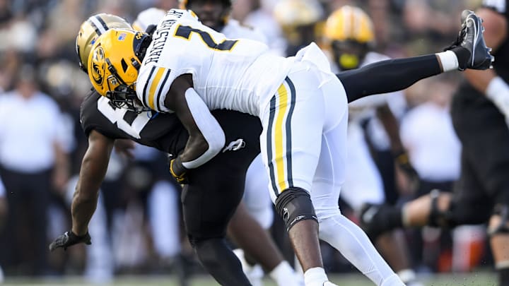 Sep 30, 2023; Nashville, Tennessee, USA; Missouri Tigers defensive back Ennis Rakestraw Jr. (2) takes down a Vanderbilt player on defense.