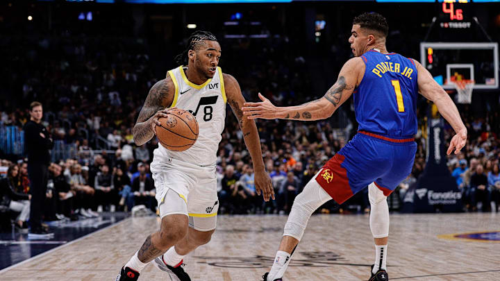 Mar 9, 2024; Denver, Colorado, USA; Utah Jazz forward Brice Sensabaugh (8) drives to the basket against Denver Nuggets forward Michael Porter Jr. (1) in the first quarter at Ball Arena. Mandatory Credit: Isaiah J. Downing-Imagn Images