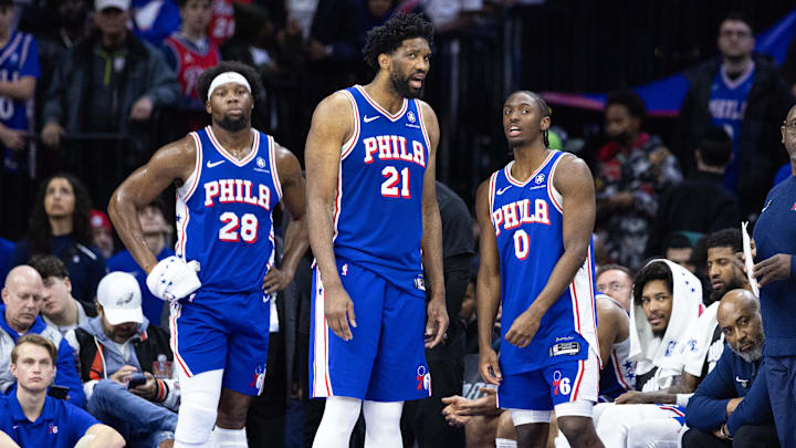 Feb 20, 2025; Philadelphia, Pennsylvania, USA; Philadelphia 76ers center Joel Embiid (21) and guard Tyrese Maxey (0) talk in the final minute of the fourth quarter against the Boston Celtics at Wells Fargo Center. Mandatory Credit: Bill Streicher-Imagn Images