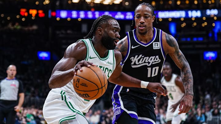 Jan 10, 2025; Boston, Massachusetts, USA; Boston Celtics guard Jaylen Brown (7) drives the ball against Sacramento Kings forward DeMar DeRozan (10) in the second half at TD Garden. Mandatory Credit: David Butler II-Imagn Images