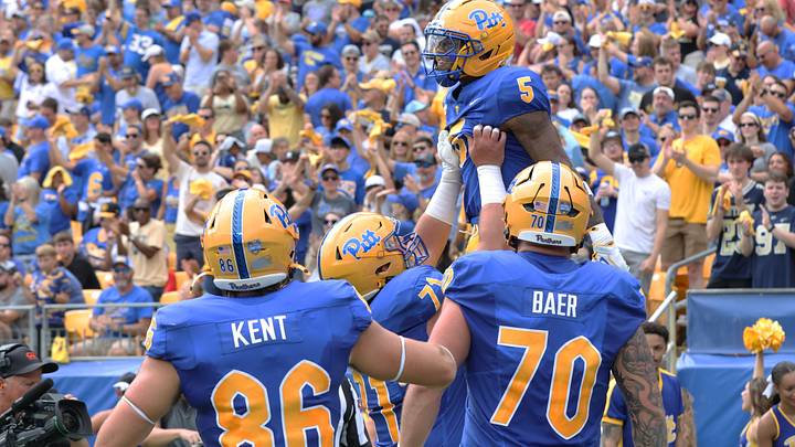 Sep 5, 2026; Pittsburgh, Pennsylvania, USA;  Pittsburgh Panthers running back Justin Cook (5) celebrates his touchdown with teammates against the Miami (OH) RedHawks during the first quarter at Acrisure Stadium.  Mandatory Credit: Charles LeClaire-Imagn Images