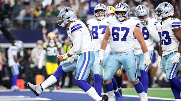 Dallas Cowboys quarterback Dak Prescott celebrates after scoring a touchdown against the Green Bay Packers.