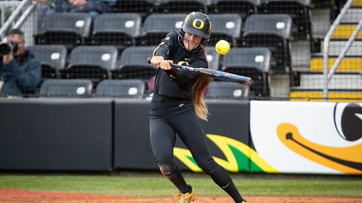 Oregon outfielder Kai Luschar hits a single as the Oregon Ducks host Washington Saturday, April 6, 2024 at Jane Sanders Stadium in Eugene, Ore.