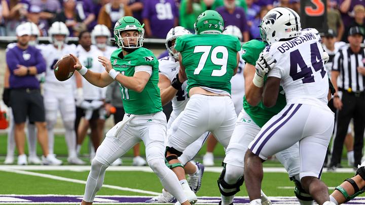 North Dakota Fighting Hawks quarterback Jerry Kaminski drops back to pass during the first quarter against Kansas State. North Dakota Fighting Hawks quarterback Jerry Kaminski drops back to pass during the first quarter against Kansas State.