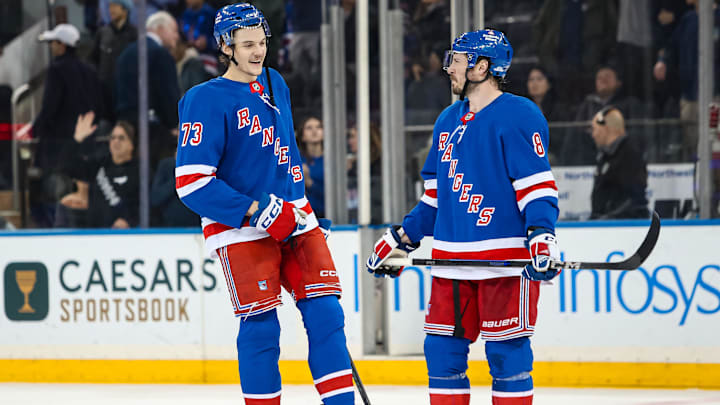 Mar 22, 2025; New York, New York, USA; New York Rangers center Matt Rempe (73) and center J.T. Miller (8) celebrate after a 5-3 win against the Vancouver Canucks at Madison Square Garden. Mandatory Credit: Danny Wild-Imagn Images