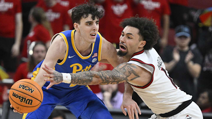 Mar 1, 2025; Louisville, Kentucky, USA;  Louisville Cardinals guard J'Vonne Hadley (1) pressures Pittsburgh Panthers forward Guillermo Diaz Graham (25) during the second half at KFC Yum! Center. Louisville defeated Pittsburgh 79-68. Mandatory Credit: Jamie Rhodes-Imagn Images