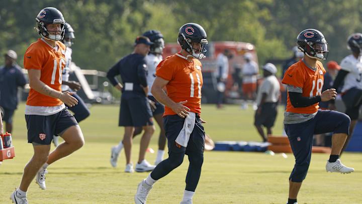 Jul 23, 2025; Lake Forest, IL, USA; Chicago Bears quarterbacks Austin Reed (16), Case Keenum (11) and Caleb Williams (18) warm up during training camp at Halas Hall.