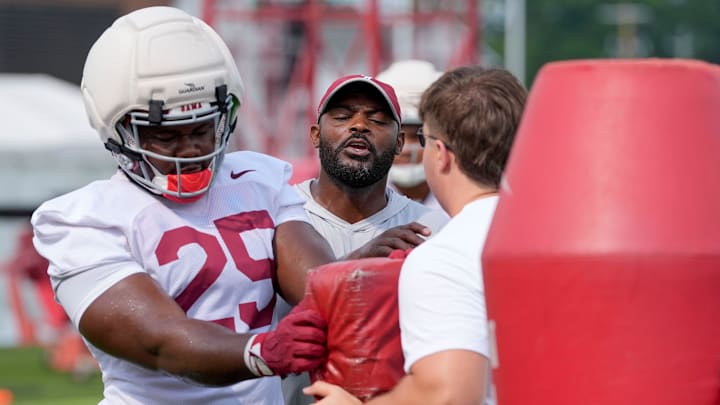 July 30, 2025; Tuscaloosa, AL, USA; Defensive line coach Freddie Roach instructs defensive lineman Steve Bolo Mboumoua on his hand position during the first practice session of the preseason for the Alabama Crimson Tide.