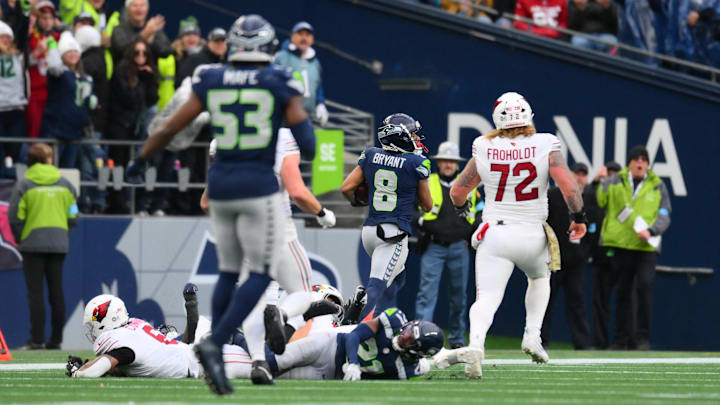 Nov 24, 2024; Seattle, Washington, USA; Seattle Seahawks cornerback Coby Bryant (8) returns an interception for a touchdown against the Arizona Cardinals during the second half at Lumen Field. Mandatory Credit: Steven Bisig-Imagn Images