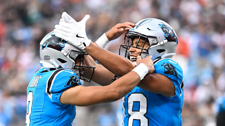 Carolina Panthers wide receiver Jalen Coker (18) celebrates with quarterback Bryce Young (9) after a touchdown catch Carolina Panthers wide receiver Jalen Coker (18) celebrates with quarterback Bryce Young (9) after a touchdown catch
