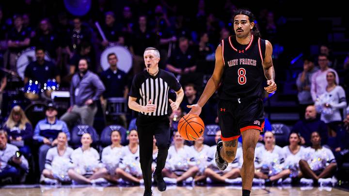 Dec 1, 2025; Cincinnati, Ohio, USA; Saint Francis Red Flash guard Skylar Wicks (8) dribbles against the Xavier Musketeers in the first half at Cintas Center. Dec 1, 2025; Cincinnati, Ohio, USA; Saint Francis Red Flash guard Skylar Wicks (8) dribbles against the Xavier Musketeers in the first half at Cintas Center.