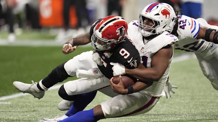 Atlanta Falcons quarterback Michael Penix Jr. (9) is sacked by Buffalo Bills defensive tackle Ed Oliver (91) during the second half of a game at Mercedes-Benz Stadium. Atlanta Falcons quarterback Michael Penix Jr. (9) is sacked by Buffalo Bills defensive tackle Ed Oliver (91) during the second half of a game at Mercedes-Benz Stadium.