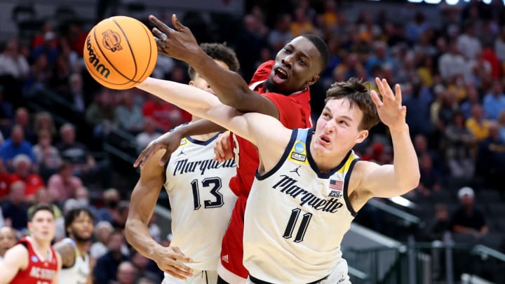 Mar 29, 2024; Dallas, TX, USA; North Carolina State Wolfpack forward Mohamed Diarra (23) and Marquette Golden Eagles guard Tyler Kolek (11) fight for a loose ball during the second half in the semifinals of the South Regional of the 2024 NCAA Tournament at American Airlines Center. Mandatory Credit: Kevin Jairaj-USA TODAY Sports 