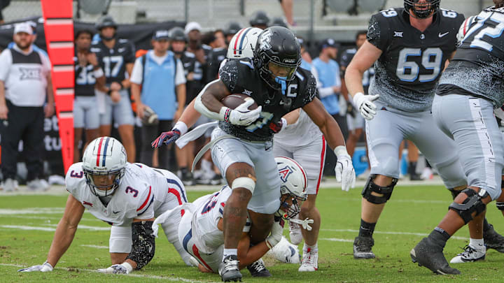 Nov 2, 2024; Orlando, Florida, USA; UCF Knights running back RJ Harvey (7) runs the ball against the Arizona Wildcats during the first quarter at FBC Mortgage Stadium.