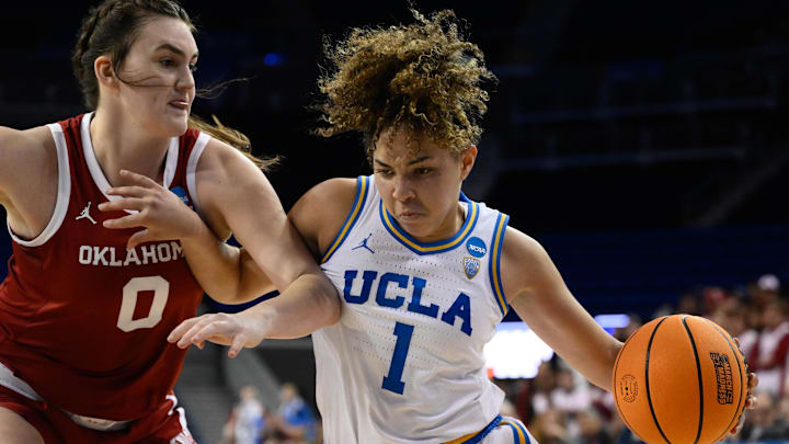 Mar 20, 2023; Los Angeles, CA, USA; UCLA Bruins guard Kiki Rice (1) drive to the basket defended by Oklahoma Sooners center Beatrice Culliton (0) during the 4th quarter of an NCAA Tournament Women   s 2nd Round dd game at Pauley Pavilion. Mandatory Credit: Robert Hanashiro-Imagn Images