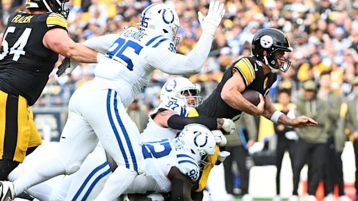 Nov 2, 2025; Pittsburgh, Pennsylvania, USA; Pittsburgh Steelers quarterback Aaron Rodgers (8) is tackled by Indianapolis Colts defensive end Laiatu Latu (97) during the first half at Acrisure Stadium. Mandatory Credit: Barry Reeger-Imagn Images