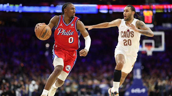 Jan 16, 2026; Philadelphia, Pennsylvania, USA; Philadelphia 76ers guard Tyrese Maxey (0) controls the ball agains Cleveland Cavaliers guard Jaylon Tyson (20) during the second quarter at Xfinity Mobile Arena. Mandatory Credit: Bill Streicher-Imagn Images