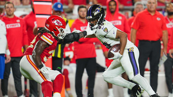 Baltimore Ravens tight end Isaiah Likely runs with the ball against Kansas City Chiefs linebacker Nick Bolton. Baltimore Ravens tight end Isaiah Likely runs with the ball against Kansas City Chiefs linebacker Nick Bolton.