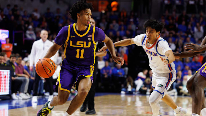 Jan 20, 2026; Gainesville, Florida, USA; Louisiana State Tigers guard Dedan Thomas Jr. (11) drives to the basket past Florida Gators guard Xaivian Lee (1) during the first half at Exactech Arena at the Stephen C. O'Connell Center. Mandatory Credit: Matt Pendleton-Imagn Images Jan 20, 2026; Gainesville, Florida, USA; Louisiana State Tigers guard Dedan Thomas Jr. (11) drives to the basket past Florida Gators guard Xaivian Lee (1) during the first half at Exactech Arena at the Stephen C. O'Connell Center. Mandatory Credit: Matt Pendleton-Imagn Images