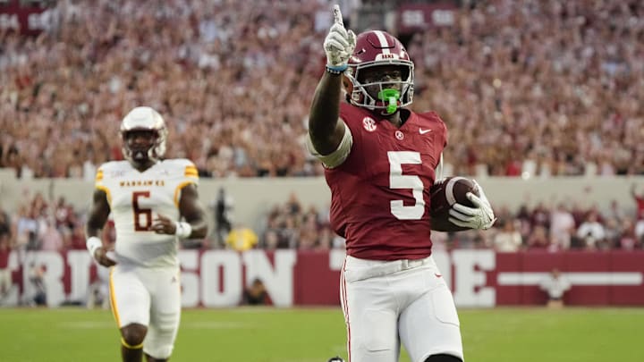 Sep 6, 2025; Tuscaloosa, Alabama, USA;  Alabama receiver Germie Bernard (5) outpaces UL Monroe linebacker Tyrese Hopkins (6) for a touchdown at Saban Field at Bryant-Denny Stadium. Mandatory Credit: Gary Cosby Jr.-Imagn Images