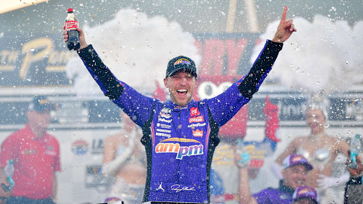 Oct 12, 2025; Las Vegas, Nevada, USA; NASCAR Cup Series driver Denny Hamlin (11) celebrates his victory following the South Point 400 at Las Vegas Motor Speedway.
