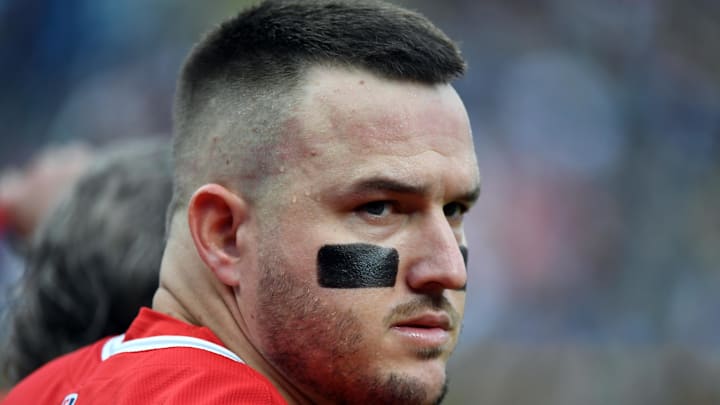 Sep 20, 2025; Denver, Colorado, USA; Los Angeles Angels designated hitter Mike Trout (27) during the national anthem before the game against the Colorado Rockies at Coors Field. Mandatory Credit: Christopher Hanewinckel-Imagn Images