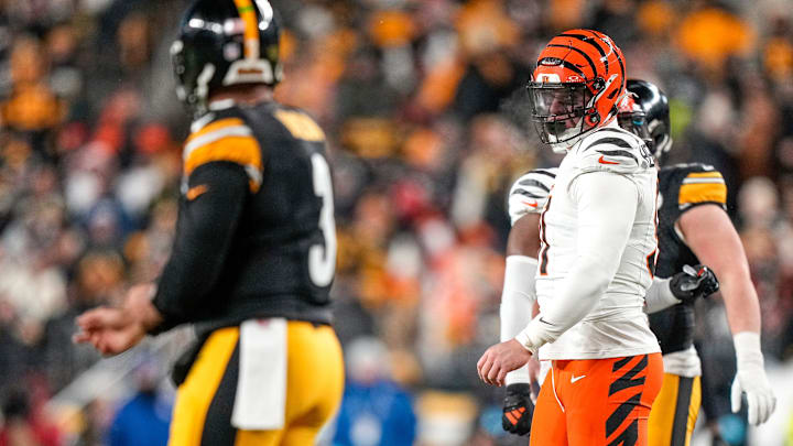 Cincinnati Bengals defensive end Trey Hendrickson (91) stares down Pittsburgh Steelers quarterback Russell Wilson (3) between plays in the first quarter of the NFL Week 18 game between the Pittsburgh Steelers and the Cincinnati Bengals at Acrisure Stadium in Pittsburgh on Saturday, Jan. 4, 2025.