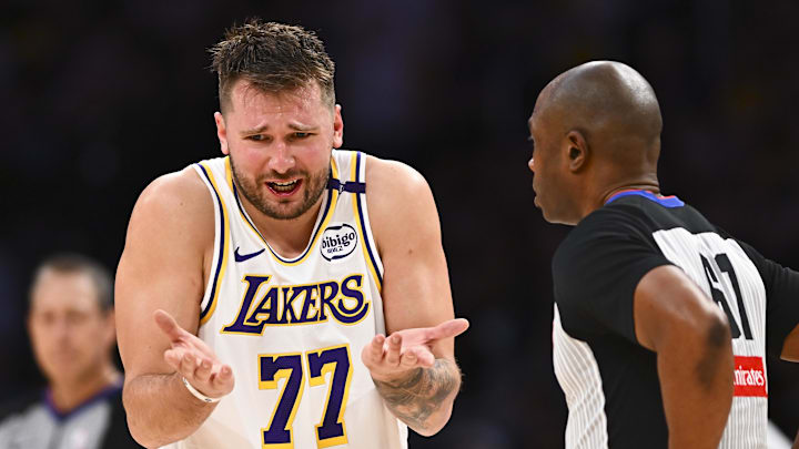 Mar 22, 2025; Los Angeles, California, USA; Los Angeles Lakers guard Luka Doncic (77) reacts to a call from referee Courtney Kirkland (61) against the Chicago Bulls during the second half at Crypto.com Arena. Mandatory Credit: Jonathan Hui-Imagn Images