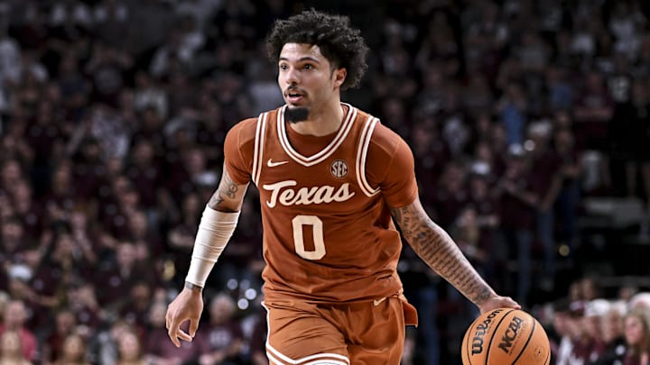 Feb 28, 2026; College Station, Texas, USA; Texas Longhorns guard Jordan Pope (0) dribbles the ball during the first half against the Texas A&M Aggies at Reed Arena. 